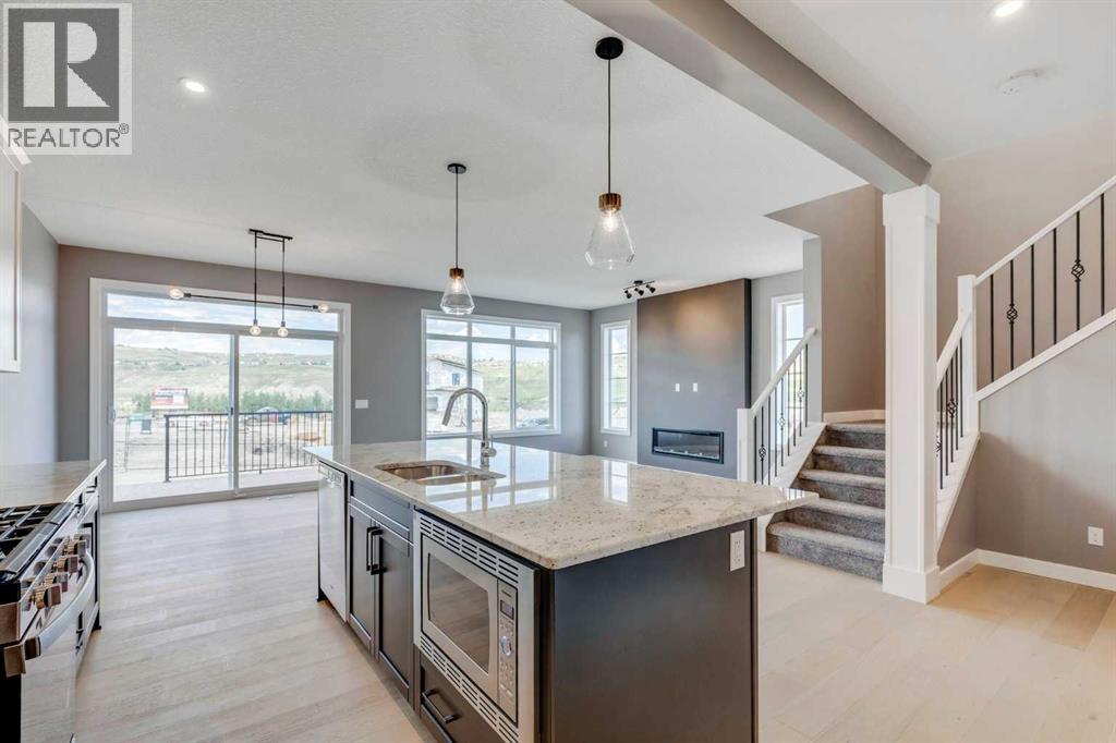 92 Sundown Crescent, Cochrane, Alberta  T4C 1Y3 - Photo 9 - A2228997