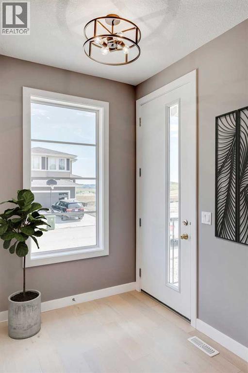 92 Sundown Crescent, Cochrane, Alberta  T4C 1Y3 - Photo 3 - A2228997