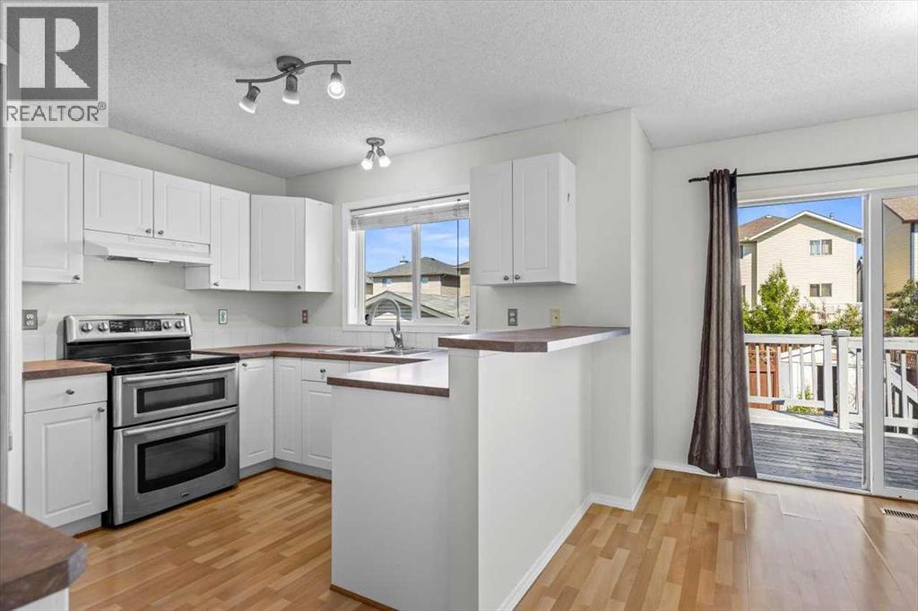 911 Arbour Lake Road Nw, Calgary, Alberta  T3G 4Z9 - Photo 7 - A2266005