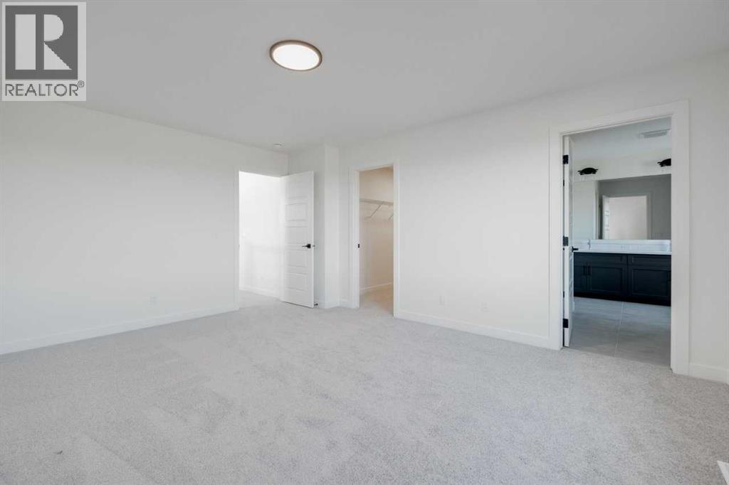 138 Northern Lights Crescent, Langdon, Alberta  T0J 1X2 - Photo 30 - A2264938