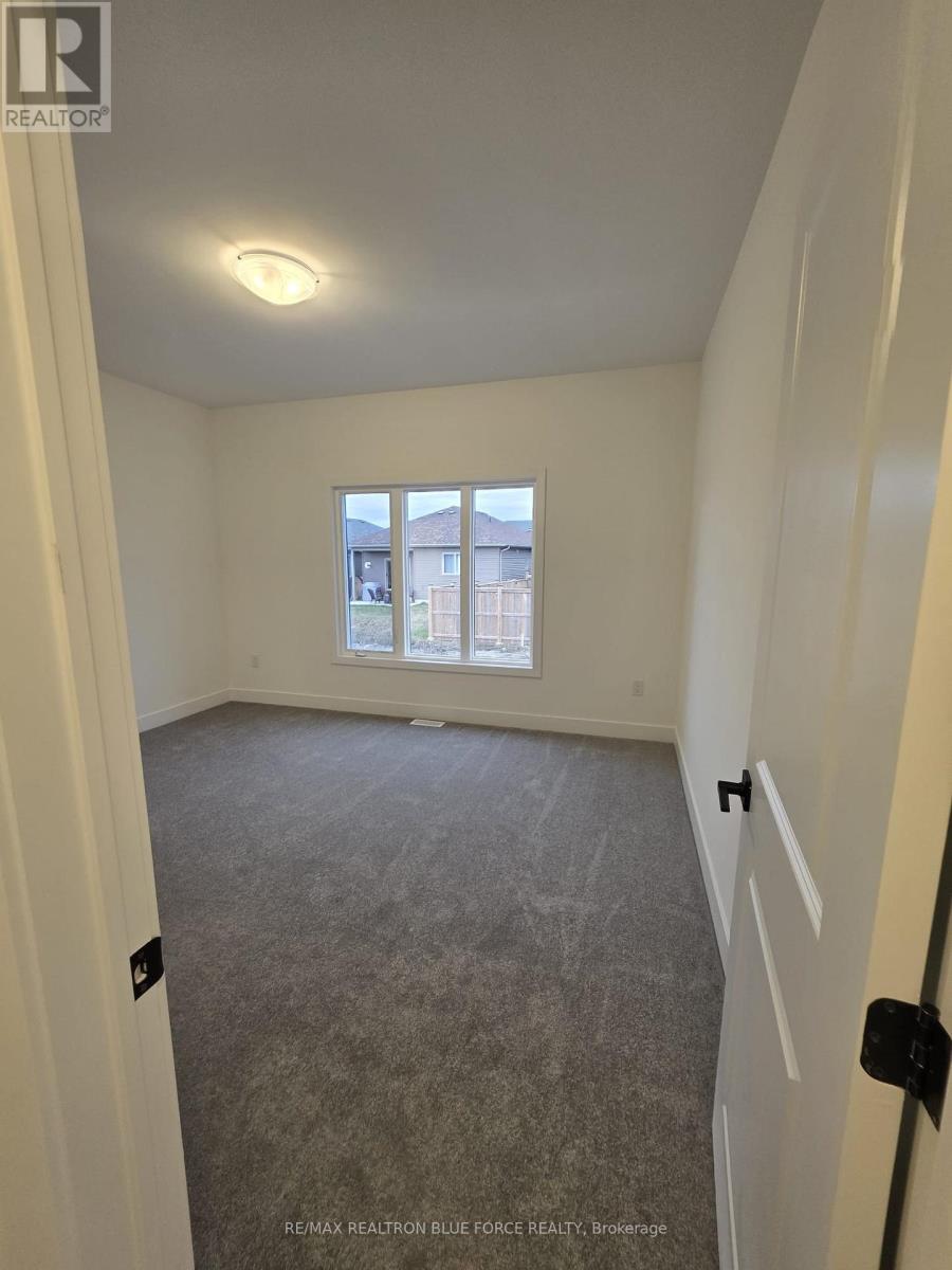 55 Dusenbury Drive, Loyalist, Ontario  K0H 2H0 - Photo 11 - X12485986