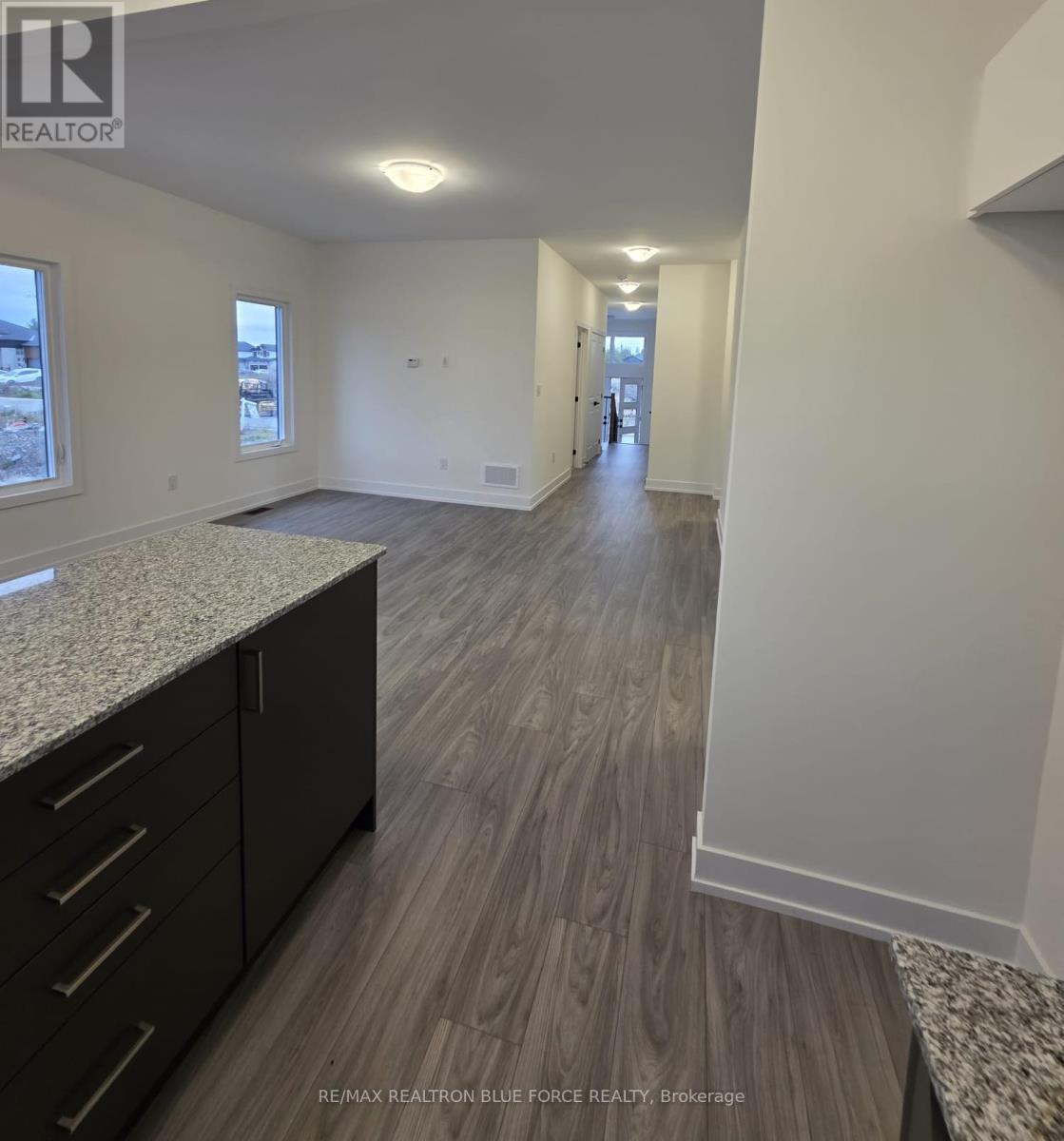 55 Dusenbury Drive, Loyalist, Ontario  K0H 2H0 - Photo 5 - X12485986