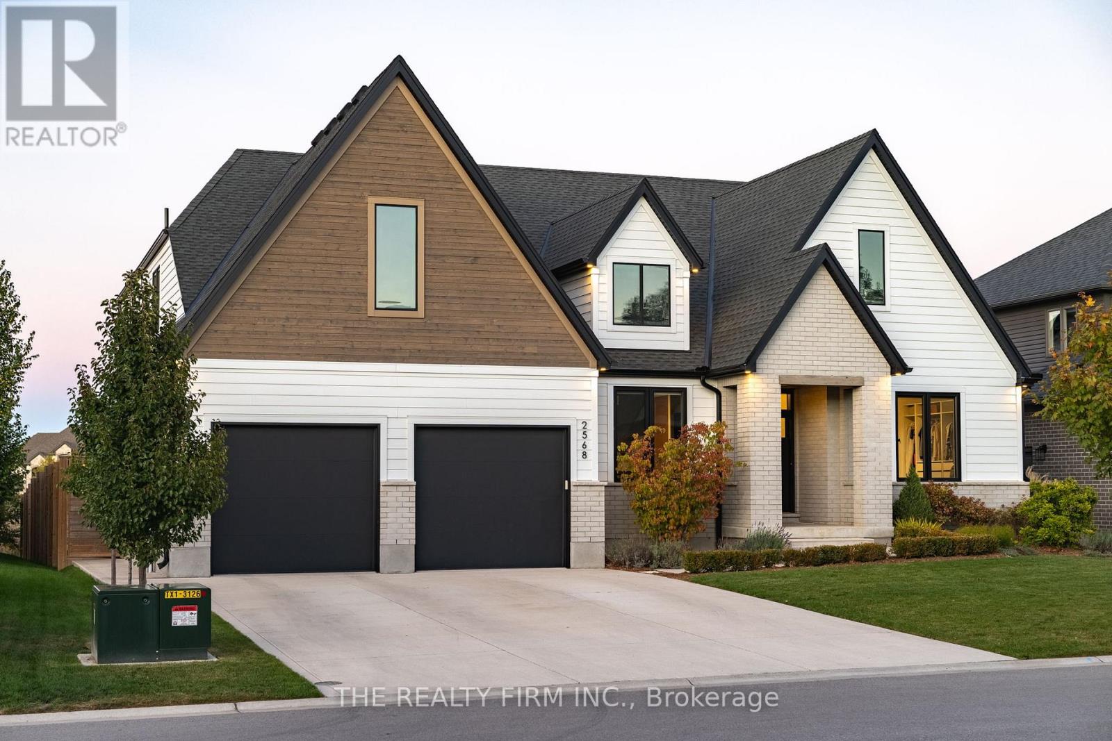 Welcome to this stunning custom-built home that blends modern luxury with thoughtful functionality. From the moment you walk in, you'll be greeted by an impressive open-concept design featuring soaring 9-, 12-, and 20-foot ceilings that create a true sense of space and sophistication. The gourmet kitchen is designed for entertaining, complete with a gas range, two dishwashers, garburator, a full butler's pantry, and reverse osmosis water filtration system. The flow from the kitchen to the dining and living areas makes hosting effortless. The main-floor primary suite is a private retreat, featuring a double shower, double sinks, and a massive walk-in closet with built-in laundry. Step right outside from your bedroom to a relaxing hot tub surrounded by pond views. Upstairs, you'll find a bathroom featuring water closet and additional well-sized rooms.  Back on the main floor, the mudroom and separate second laundry room with clothes chute from the upper level offer practical convenience for everyday living. The lower level is made for both wellness and fun - featuring a large gym, a luxurious sauna with heated floors and a steam shower, a juice bar with its own dishwasher, and even a hidden room waiting to be discovered. Step outside to your cottage-like backyard with a sprawling deck overlooking the neighbourhood pond. Enjoy evenings under the stars, watch the kids on the built-in trampoline (sourced from a local trampoline park), and unwind in the peaceful natural setting. Additional highlights include a large garage, in-ground sprinklers, high-quality heat recovery ventilator, UV with charcoal water filtration, and more. Every inch of this home has been designed with comfort, luxury, and lifestyle in mind - offering a truly one-of-a-kind living experience. (id:48254)