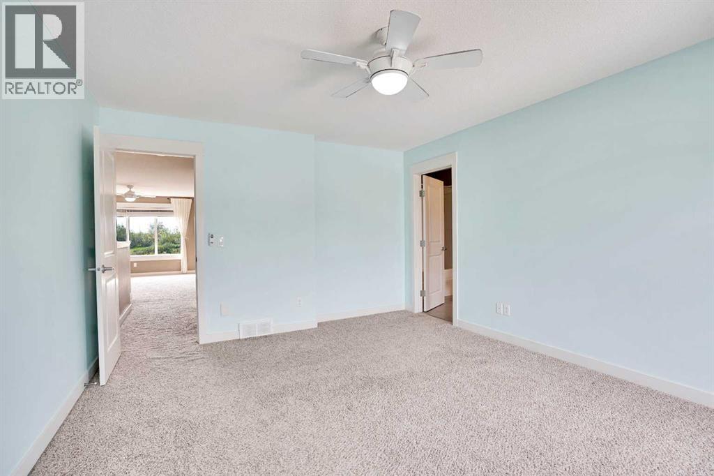 157 Rainbow Falls Boulevard, Chestermere, Alberta  T1X 0N6 - Photo 25 - A2254670