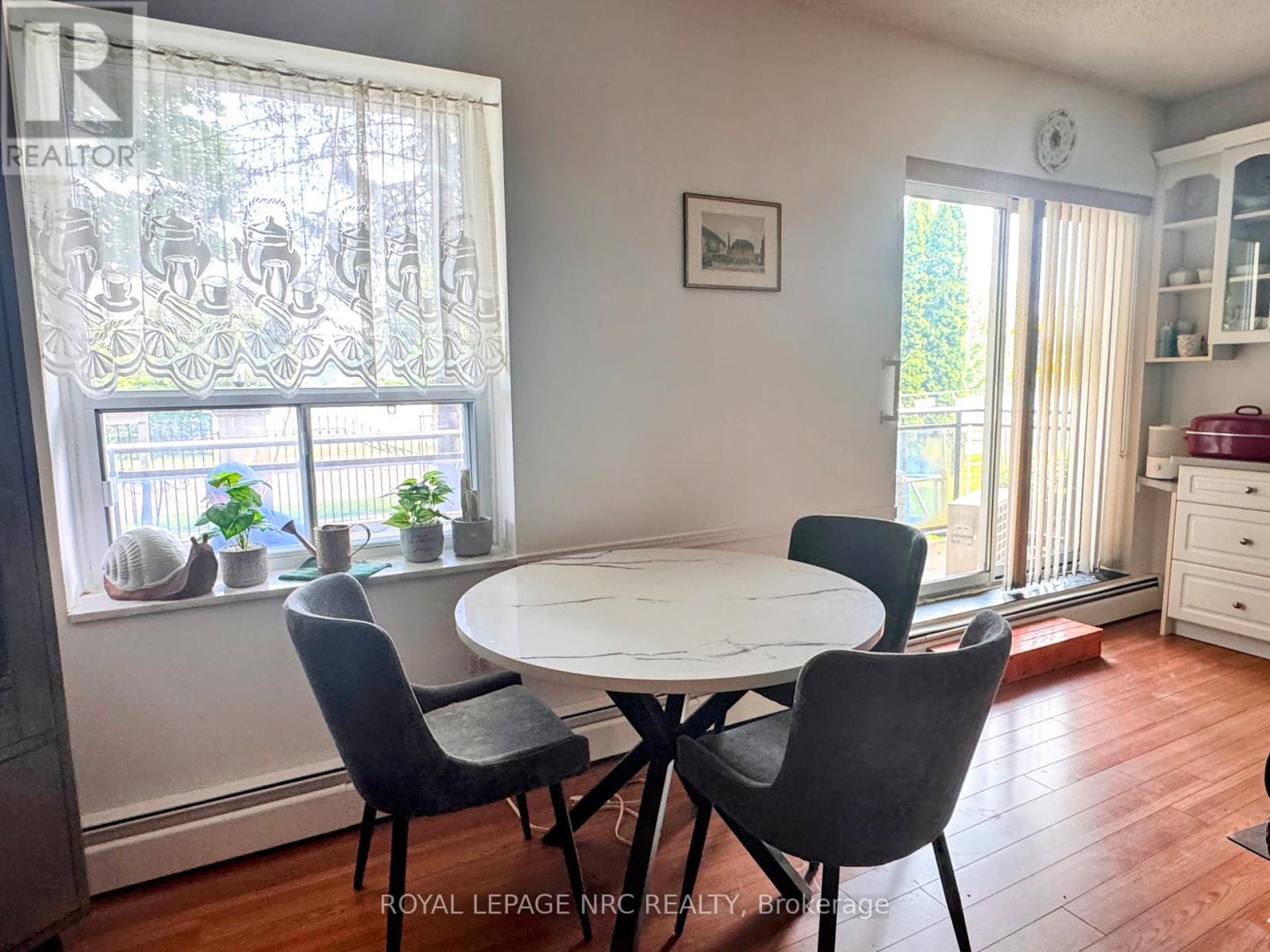 101 - 6390 Huggins Street, Niagara Falls (Stamford), Ontario  L2J 1H1 - Photo 3 - X12487354