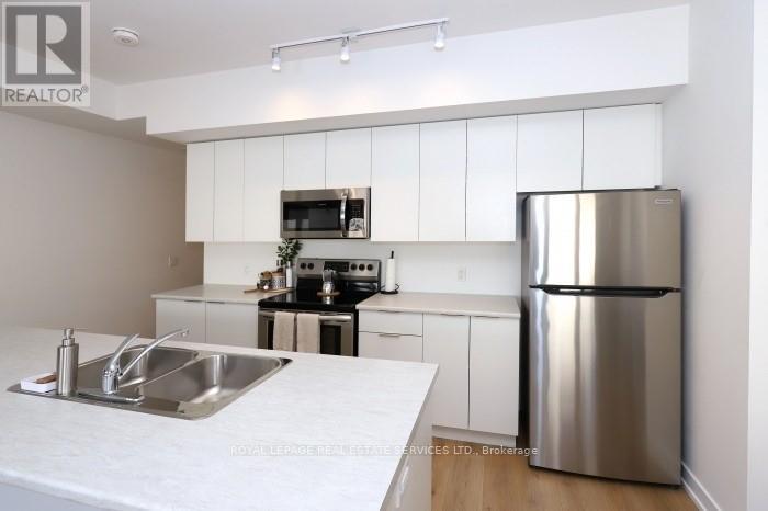 347 - 3066 Sixth Line, Oakville, Ontario  L6M 1P8 - Photo 4 - W12487108