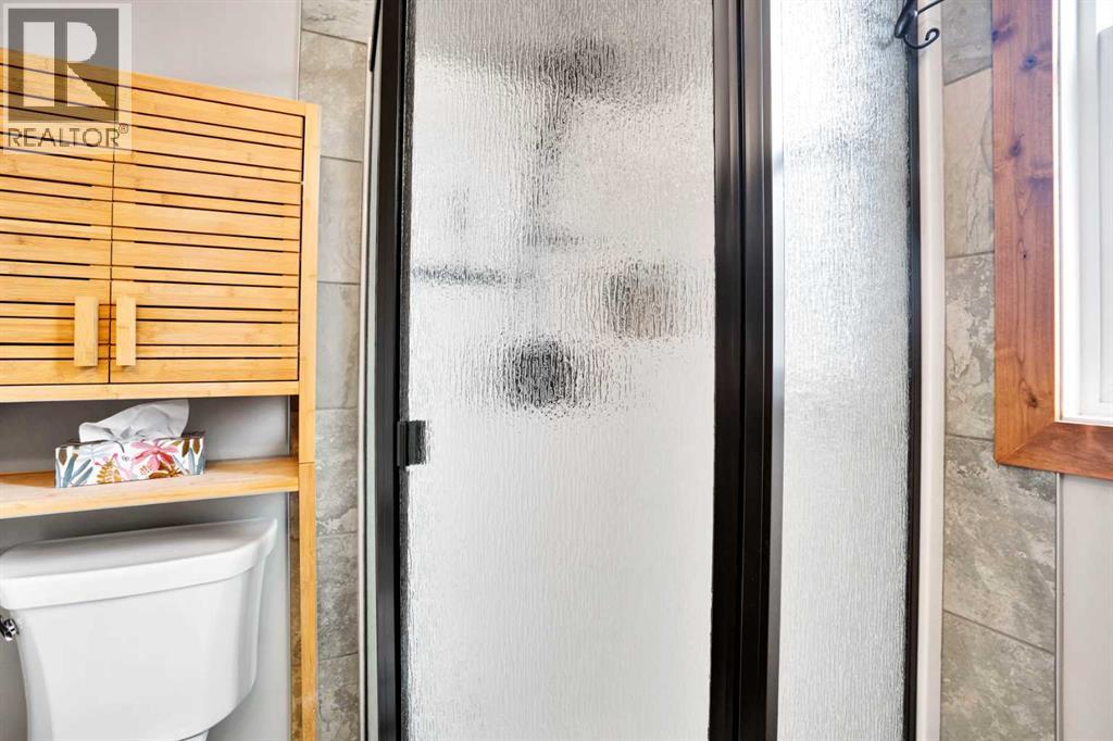 210 Cottageclub Crescent, Rural Rocky View County, Alberta  T4C 1B1 - Photo 15 - A2260091