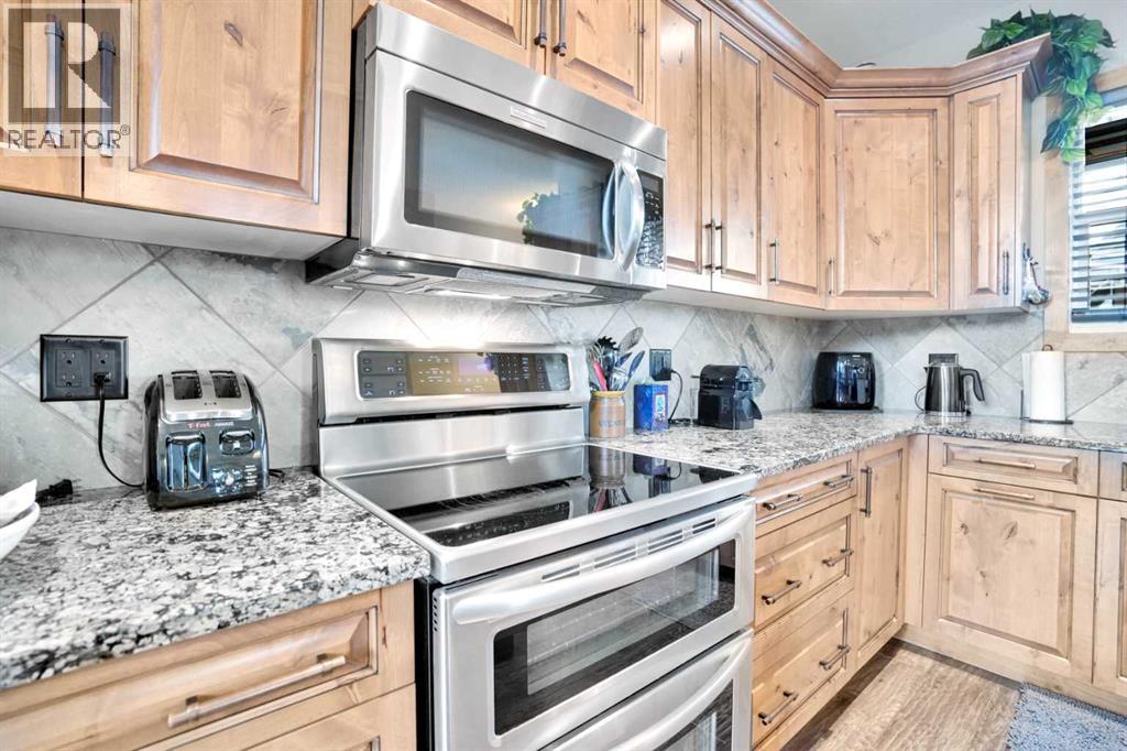 210 Cottageclub Crescent, Rural Rocky View County, Alberta  T4C 1B1 - Photo 8 - A2260091