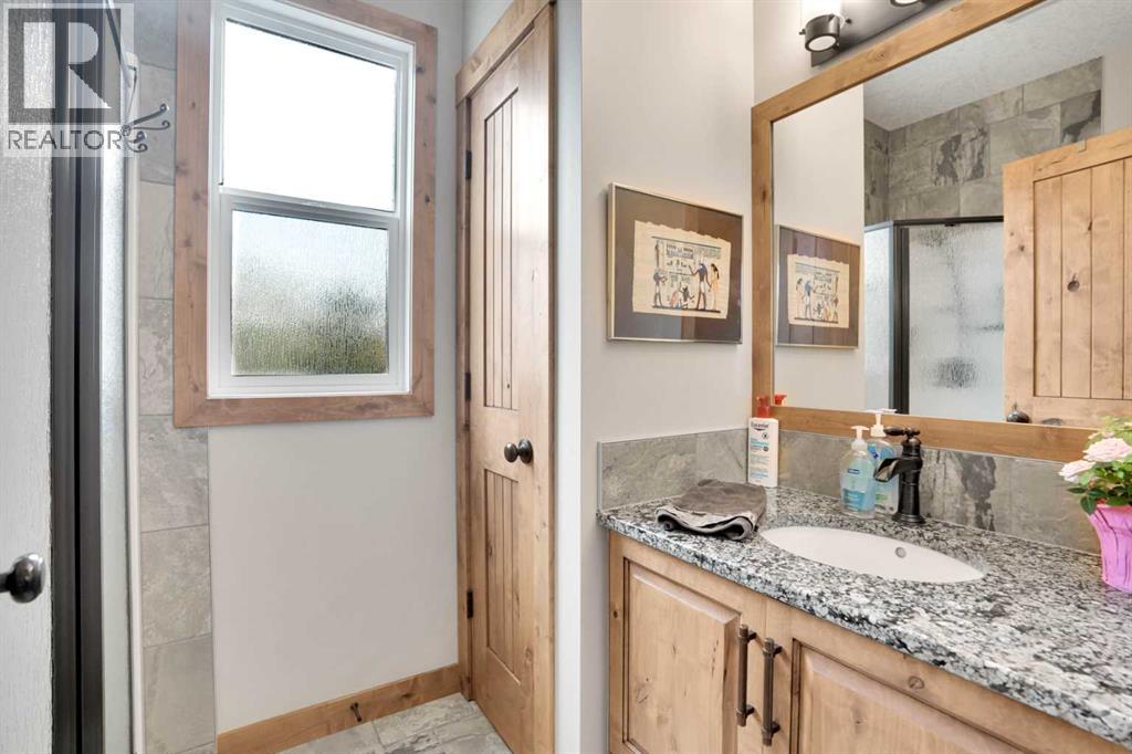 210 Cottageclub Crescent, Rural Rocky View County, Alberta  T4C 1B1 - Photo 14 - A2260091