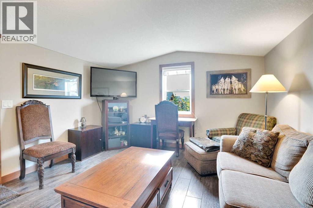 210 Cottageclub Crescent, Rural Rocky View County, Alberta  T4C 1B1 - Photo 29 - A2260091