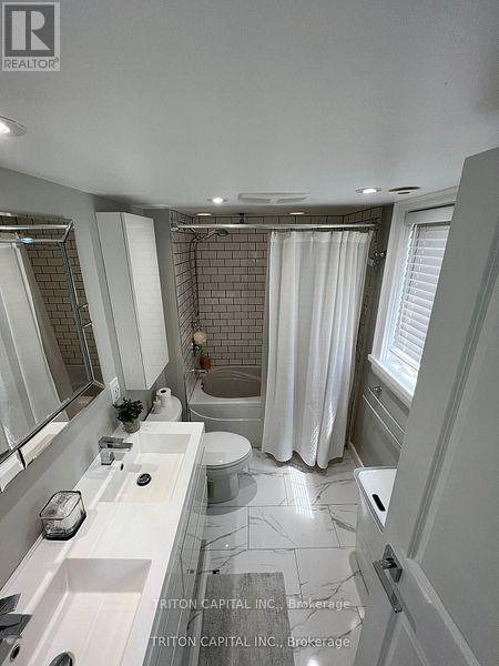 Th99 - 9 Windermere Avenue, Toronto, Ontario  M6S 5A4 - Photo 8 - W12490594