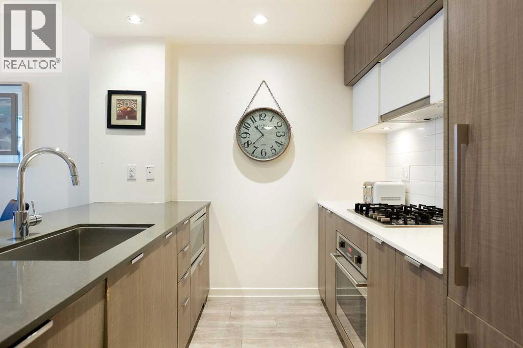 205, 51 Waterfront Mews Sw, Calgary, Alberta  T2P 0X3 - Photo 2 - A2263772