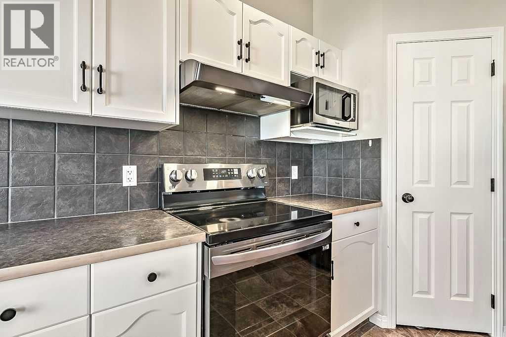 394 Cimarron Boulevard, Okotoks, Alberta  T1S 0A9 - Photo 6 - A2263407