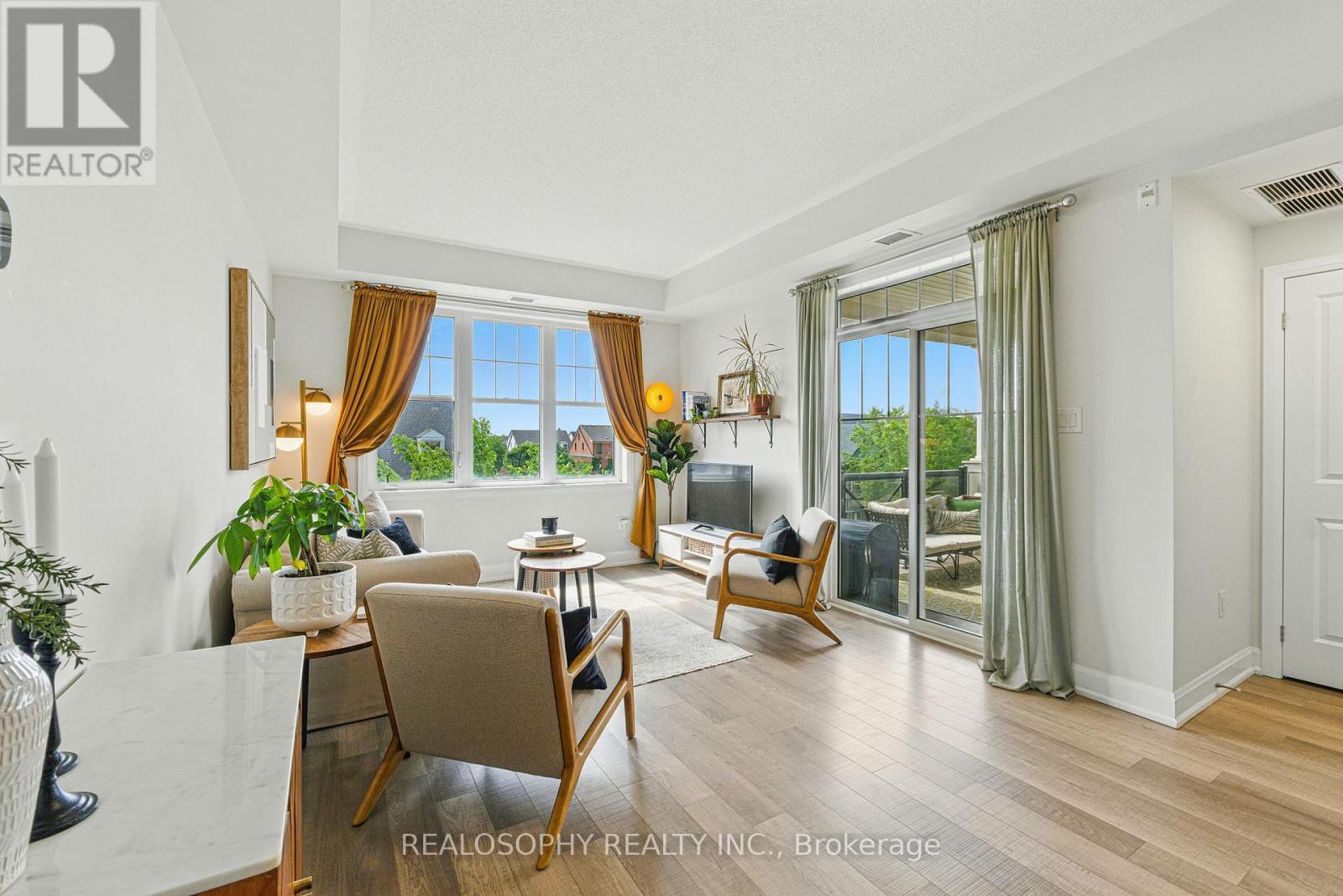 304 - 2333 Sawgrass Drive, Oakville, Ontario  L6H 0L2 - Photo 1 - W12492398