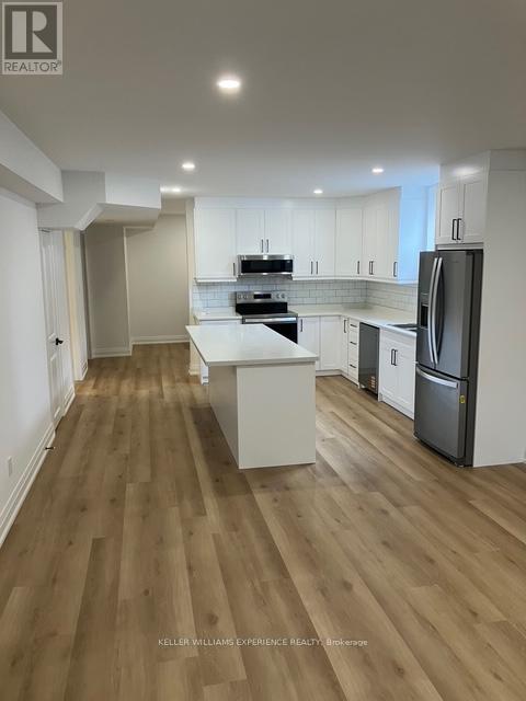 65 Baycroft Boulevard, Essa, Ontario  L3W 0M1 - Photo 4 - N12374561