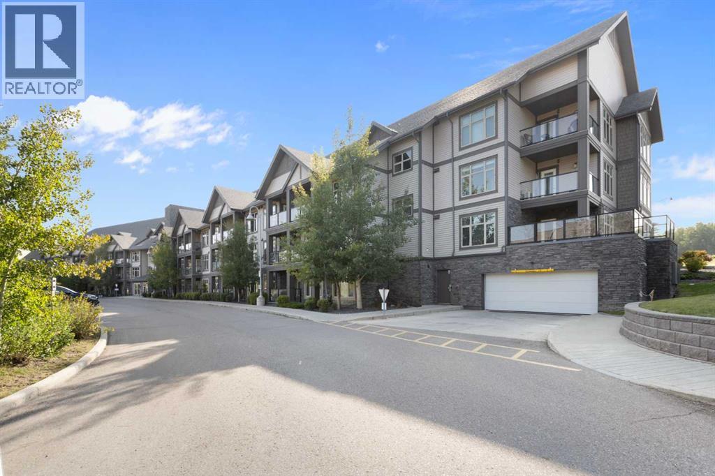 OH Sat 11-1. Sophisticated design and a phenomenal location come together in this 1430 sq ft multi-level top floor condo in Valmont at Aspen Stone. A convenient dual primary bedroom layout offers incredible flexibility for families, downsizers or investors with each suite thoughtfully separated for ultimate privacy. The main floor is incredibly welcoming with a grand open plan with high-end upgrades and finishes. The sleek kitchen inspires culinary creativity featuring full height cabinets, stainless steel appliances, quartz countertops and a waterfall edge peninsula island with casual seating. A spacious dining area accommodates entertaining with ease while also functioning as a flexible work-from-home zone. Adjacently, the inviting living room is enhanced by a custom built-in media centre and oversized windows that fill the space with natural light, opening onto a glass railed balcony that makes barbequing and outdoor relaxation effortless. A generously sized primary bedroom on this level is styled with elegant lighting and dual walk-through closets that connect to a luxurious 5 pc ensuite boasting dual sinks, a soaker tub and a glass shower. Completing this floor are in-suite laundry with ample storage and a convenient powder room. Upstairs, a second private primary suite mirrors the sense of comfort with its own 4 pc ensuite and a custom walk-in closet, making it ideal for children, extended family, guests or even a flexible office space. 2 titled side-by-side parking stalls in the heated underground parkade plus a storage locker provide practical convenience. Residents enjoy access to on-site fitness facilities, guest suites, bike storage and abundant visitor parking. The location is exceptional with Webber Academy, Rundle College and other top schools nearby and a short walk connects you to the upscale shops and eateries of Aspen Landing including Ladybug Café and Blush Lane. Westside Recreation Centre and the 69 Street LRT station are minutes away, offering q uick access downtown. Scenic walking paths around the community wetland pond add a touch of nature to the everyday. This refined condo blends modern upgrades, thoughtful function and a lifestyle defined by both luxury and convenience! Open House Sat/Sun 12-2. (id:48254)