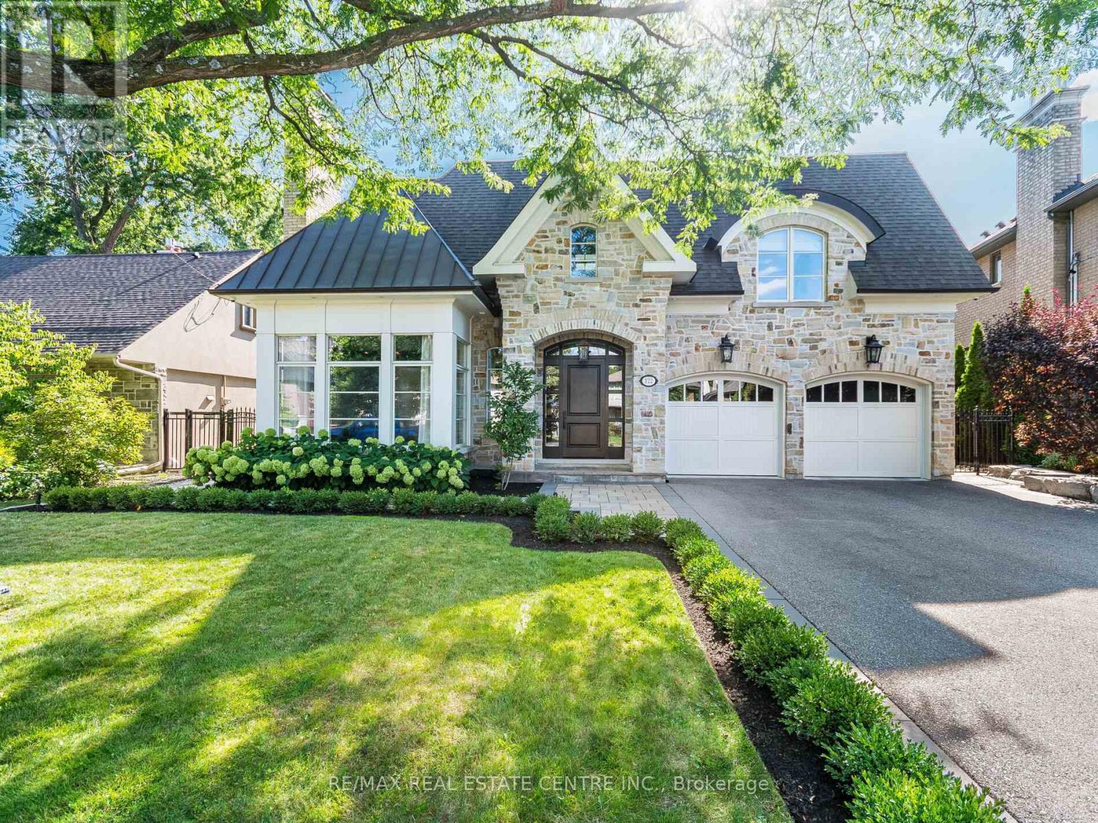 Modern masterpiece in prestigious Humber Valley!! Welcome to 122 Wimbleton Road, an architecturally stunning custom residence nestled in the heart of Toronto's exclusive Humber Valley. Designed by renowned architect David Small, this bespoke 4+1 bedroom, 5-bathroom home offers over 6,000 square feet of exceptional living space, masterfully blending modern West Coast elegance with seamless indoor-outdoor living. Located within a top-tier school catchment, this home is just a short walk to some of Toronto's most sought-after public, private and Montessori schools, making it ideal for families seeking elite education in a prime location. Custom Sapele Mahogany front door leading to dramatic foyer with soaring 20ft. ceiling and radiant natural light. 10ft ceilings on the main level and 9ft on the upper and lower levels. Quarter-sawn white oak flooring on the main and upper levels with hand-scraped hardwood in the lower level. Gourmet kitchen by Marcon featuring Wolf, Sub-Zero and Miele appliances. Walls of glass open to a Serene backyard oasis with a  16x32x8ft saltwater pool w/waterfall, outdoor gas fireplace and TV. Spa-inspired primary ensuite with 1" water line, Aqua brass fixtures and heated floors. Radiant heated lower level with glass-enclosed gym and custom wine cellar by Rosehill. ELAN smart home automation: whole-house A/V, lighting, security and intercom. Designer lighting and Hunter Douglas blinds throughout. Crafted with integrity and artistry - reclaimed brick from a historic church, Golden Brand wood windows and meticulous wood sheathing - this residence is both a work of architecture and a home of enduring warmth (id:48254)