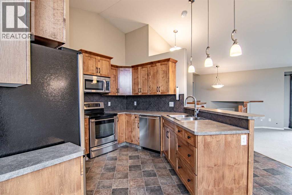 61 Mann Drive, Penhold, Alberta  T0M 1R0 - Photo 25 - A2248337