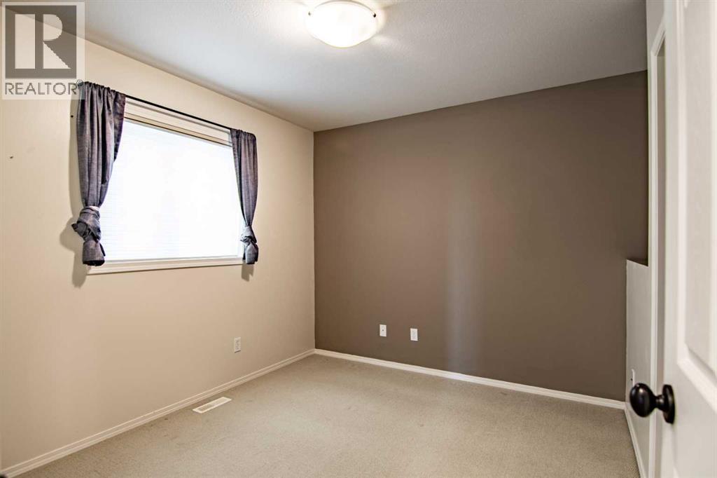 61 Mann Drive, Penhold, Alberta  T0M 1R0 - Photo 26 - A2248337