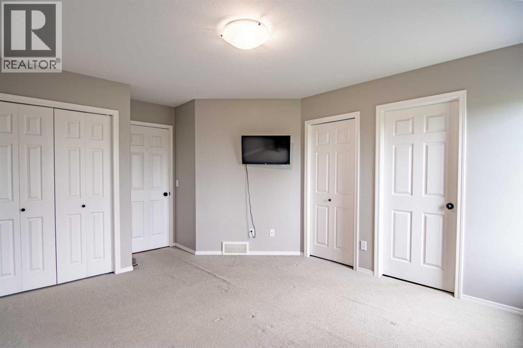 61 Mann Drive, Penhold, Alberta  T0M 1R0 - Photo 32 - A2248337