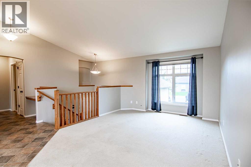 61 Mann Drive, Penhold, Alberta  T0M 1R0 - Photo 19 - A2248337