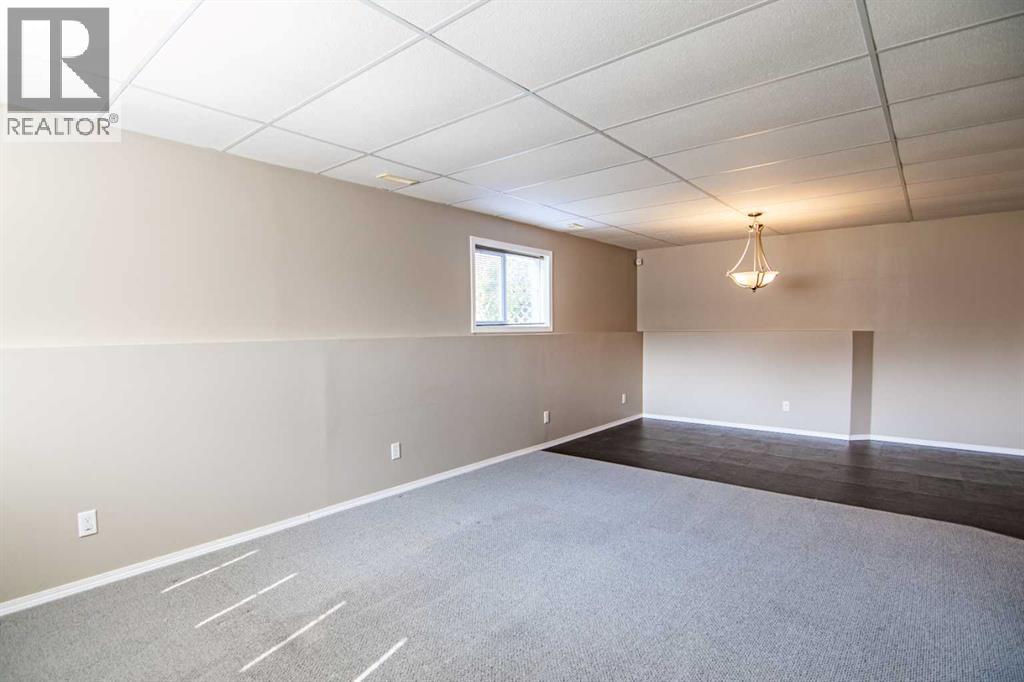 61 Mann Drive, Penhold, Alberta  T0M 1R0 - Photo 38 - A2248337