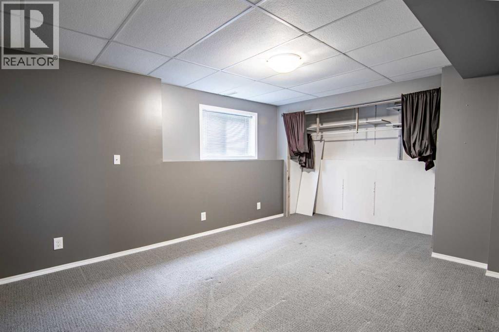 61 Mann Drive, Penhold, Alberta  T0M 1R0 - Photo 46 - A2248337