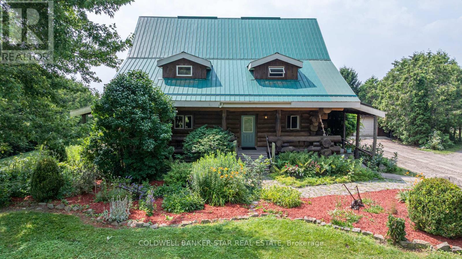 Welcome to 42431 Ron McNeil Line - a beautiful 3717 sq ft one of a kind true-scribed log home, located on a treed 2.562 acre country lot. This stunning log home is full of warmth and character and ready for your family to move in and enjoy for years to come. Driving up to this home, you'll notice the huge wrap-around porch that encompasses 3 sides of the home. The main floor of this home features a Kitchen & Diningroom with a soaring ceiling height of 28' with views to the 2nd floor balcony, a Livingroom - with a nook that's perfect for relaxing or intimate conversations, a south facing Familyroom - with a cozy free-standing gas fireplace/stove and a side entry with access to the basement and the side porch. Note the gleaming biscuit jointed and plugged hardwood forest flooring which consists of an assortment of Ash, Maple, Cherry, Walnut and spalted Maple. This level also offers a 4 piece Bath and a main floor Laundry. The second floor is accessed via a grand staircase to 3 Bedrooms with red pine flooring - the Primary with ensuite access to the main 4 piece Bath, all overlooking the main floor from the upper balcony. The basement level is finished (strapped ceiling) as a large Recreation Room and potential for 3 more Bedrooms, a Craft Room, Workshop / Storage Room and a Utility Room. Outside you'll find a 28' x 32' two car garage with hydro, water and and in-floor heating (4 zones) - the stainless steel sinks, counters and 2 owned HWT's are included, plus a 10' x 32' lean-to addition. Bonus - for the hobbyist, mechanic, car collector, there's a 40' x 56' x 14' H pole-barn style shop with 3 -12' x 12' roll-up doors and a workshop area with a mezzanine that includes a 60A hydro service for your welder. Other pertinent features include a 200A hydro service, 63' deep well and a septic system. This home is close to all amenities-St Thomas, London and Hwy 401 if you need to travel further. Please don't miss your opportunity to own this spectacular family home. (id:48254)