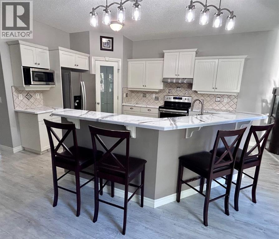 112 Panamount Green Nw, Calgary, Alberta  T3K 5R7 - Photo 5 - A2243693