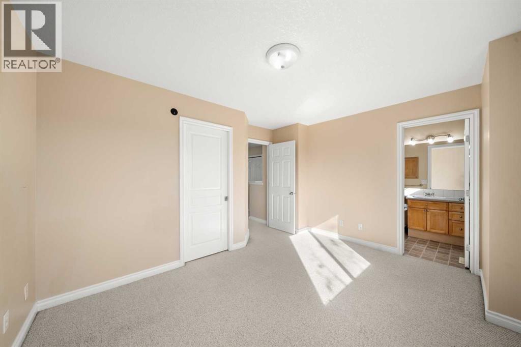 70 Crystal Shores Cove, Okotoks, Alberta  T1S 2B4 - Photo 16 - A2260860