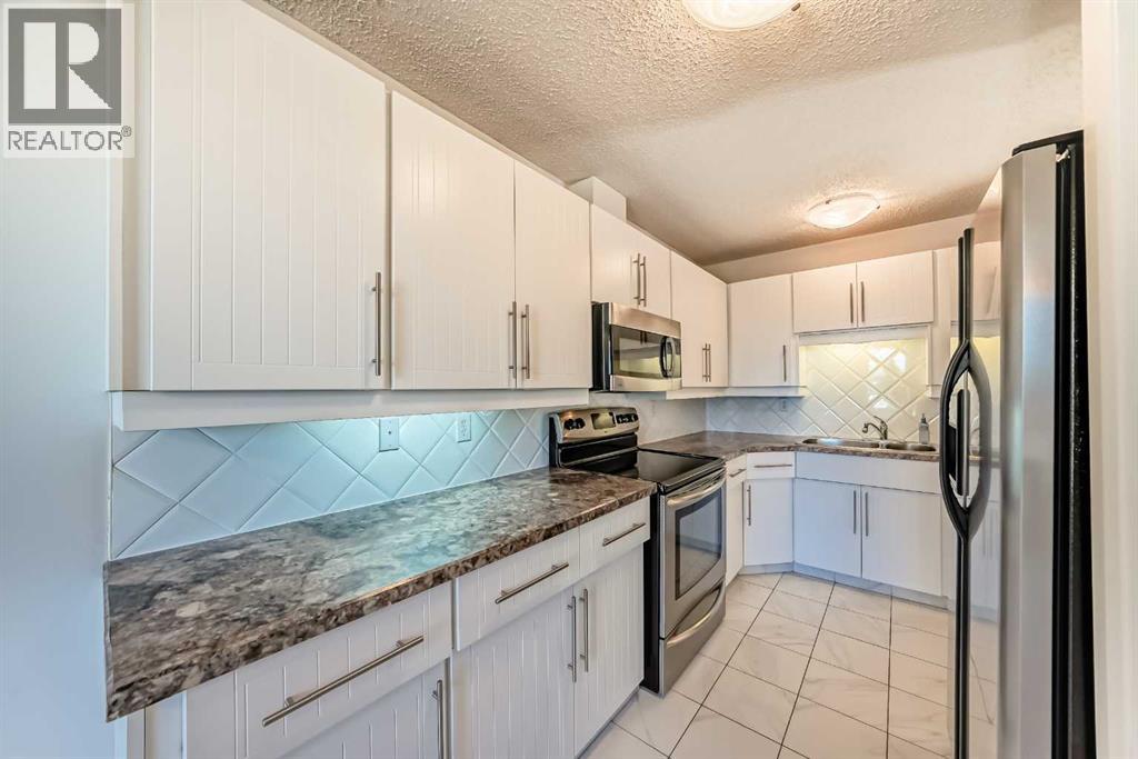 40 Glenpatrick Crescent, Cochrane, Alberta  T0L 0W3 - Photo 6 - A2263301