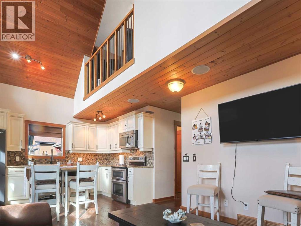 256 Cottageclub Crescent, Rural Rocky View County, Alberta  T4C 1B1 - Photo 10 - A2265981