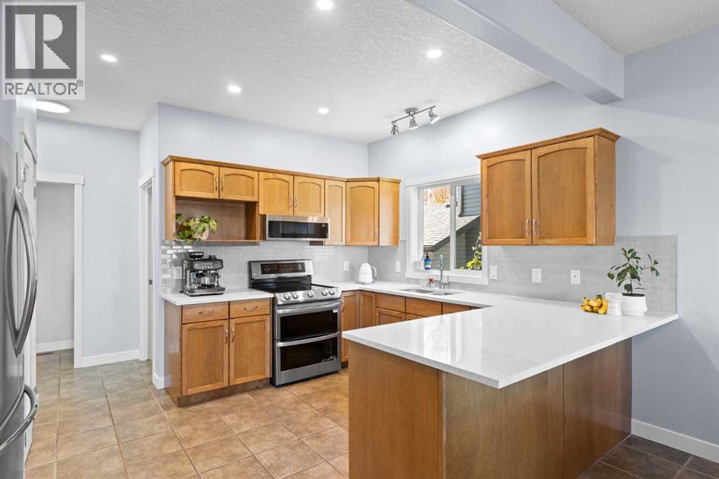 23 Collins Crescent, Crossfield, Alberta  T0M 0S0 - Photo 5 - A2264627