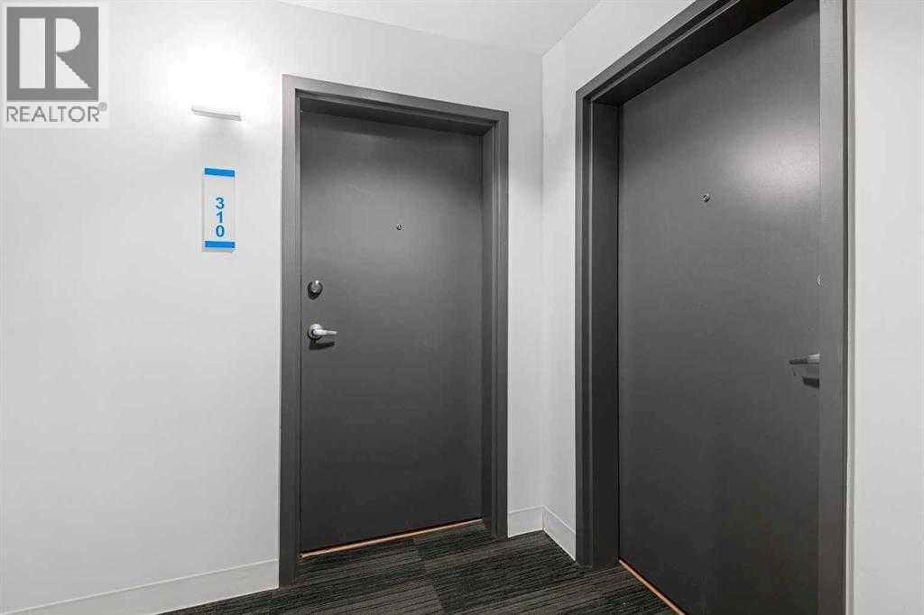 310, 1087 2 Avenue Nw, Calgary, Alberta  T3H 5L9 - Photo 4 - A2261171