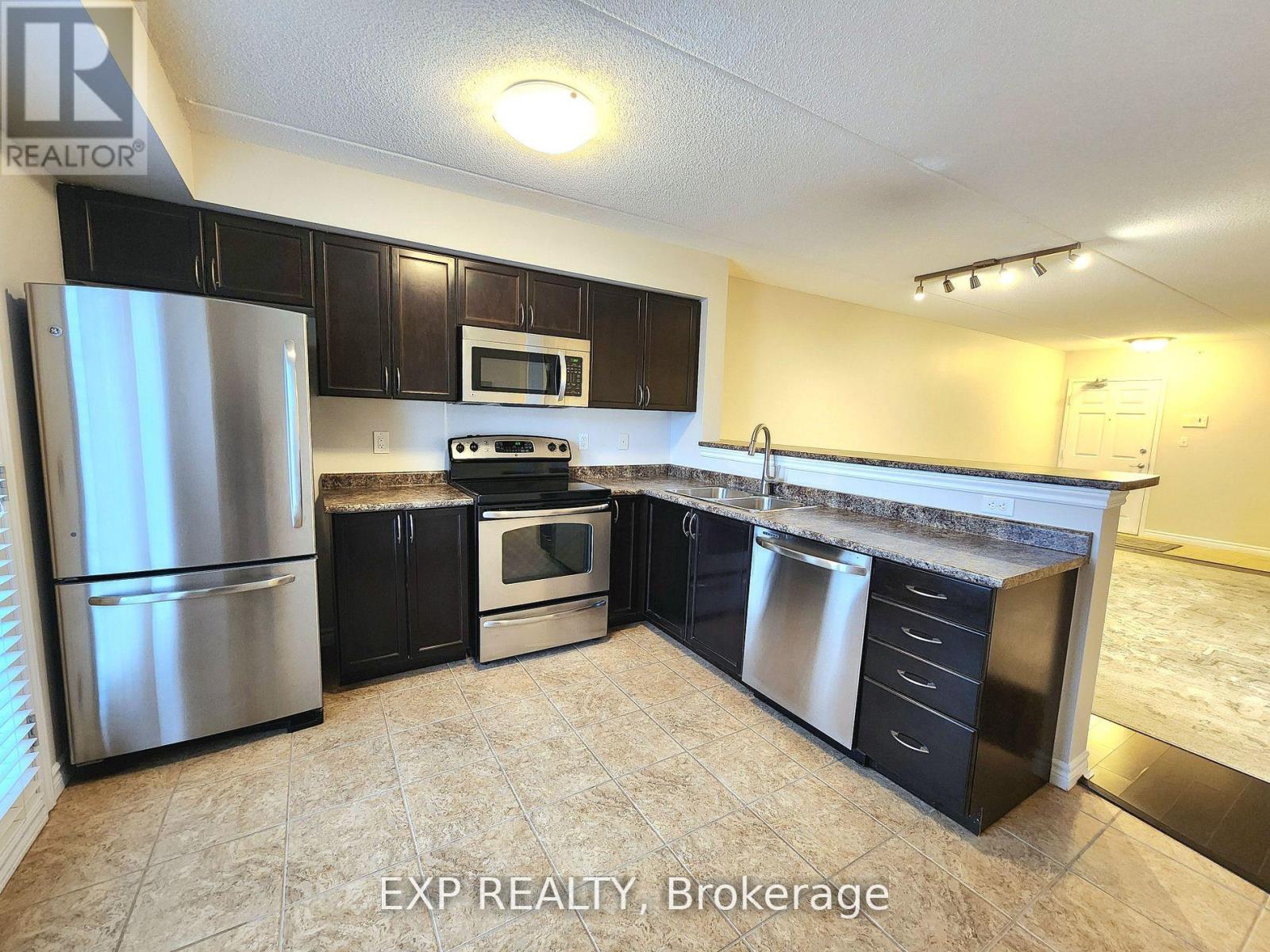 305 - 1350 Main Street E, Milton, Ontario  L9T 7S6 - Photo 2 - W12505460