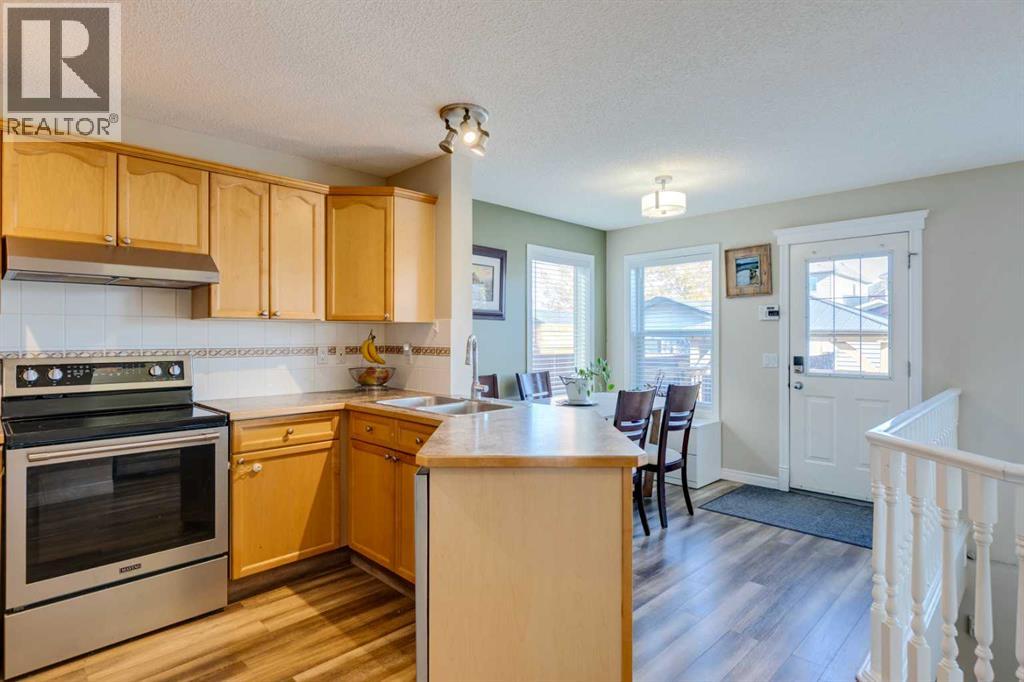 85 Crystal Shores Crescent, Okotoks, Alberta  T1S 2B5 - Photo 6 - A2266485