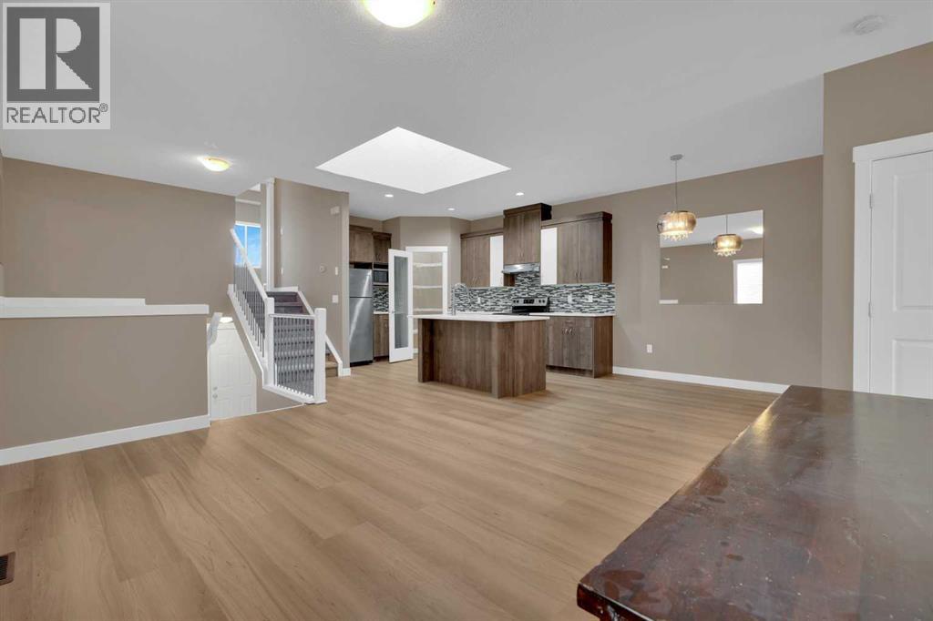 87 Baysprings Way Sw, Airdrie, Alberta  T4B 0R7 - Photo 4 - A2264015