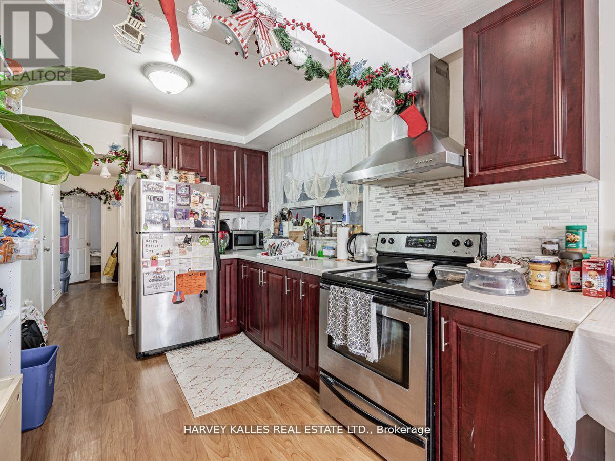 6 Carrington Avenue, Toronto, Ontario  M6E 2C3 - Photo 5 - W12513536