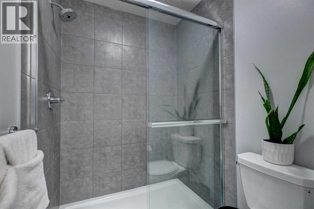 878 Bluerock Way Sw, Calgary, Alberta  T2Y 0S5 - Photo 24 - A2257906