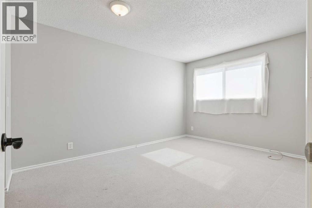 102, 7416 Hunterview Drive Nw, Calgary, Alberta  T2K 5J2 - Photo 17 - A2256834