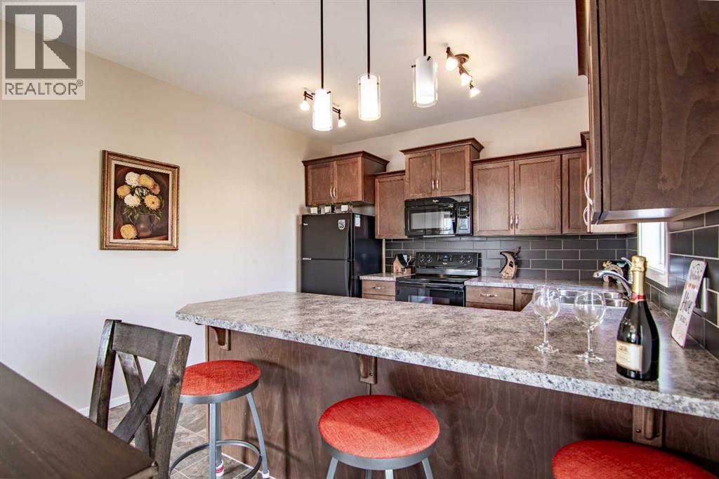 129 Mann Drive, Penhold, Alberta  T0M 1R0 - Photo 14 - A2254862