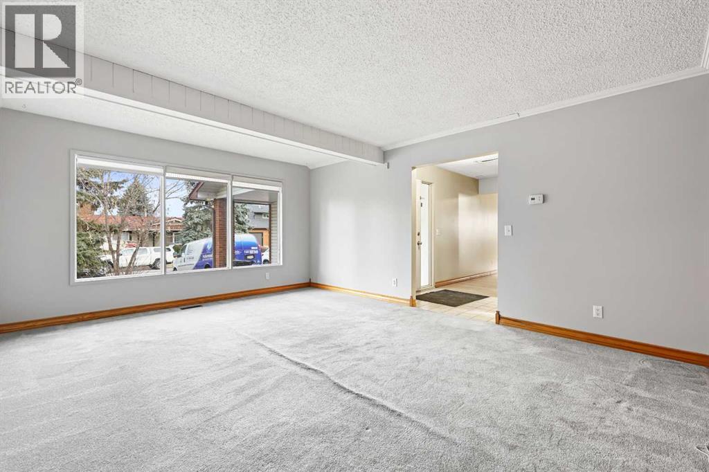 115 Brookgreen Drive Sw, Calgary, Alberta  T2W 2W4 - Photo 3 - A2268291