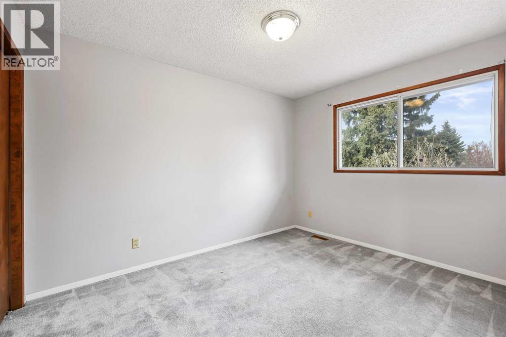 115 Brookgreen Drive Sw, Calgary, Alberta  T2W 2W4 - Photo 9 - A2268291