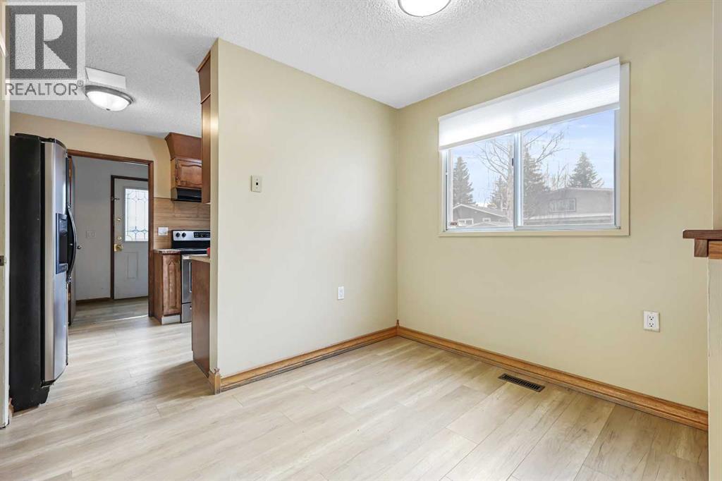 115 Brookgreen Drive Sw, Calgary, Alberta  T2W 2W4 - Photo 5 - A2268291