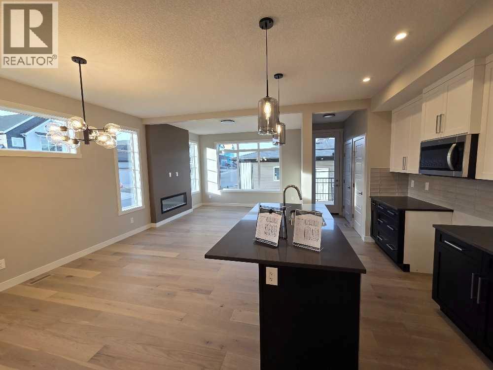 83 Lambeau Lane Se, Airdrie, Alberta  T4A 3P3 - Photo 5 - A2252044