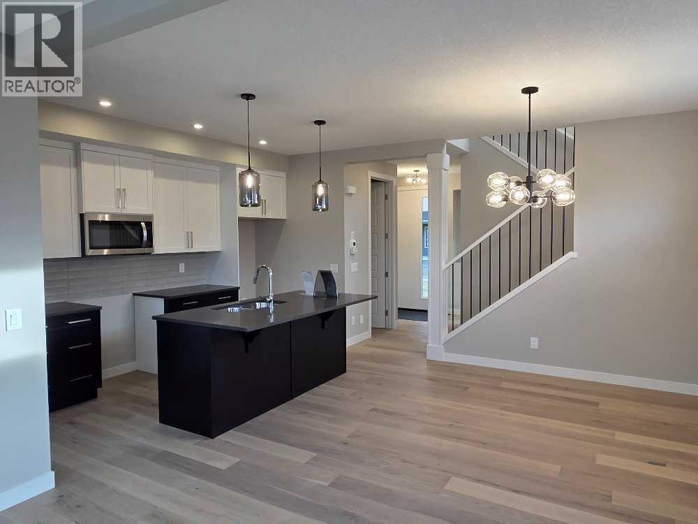 83 Lambeau Lane Se, Airdrie, Alberta  T4A 3P3 - Photo 6 - A2252044