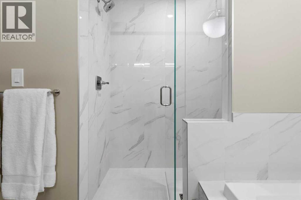 313, 15 Cougar Ridge Landing Sw, Calgary, Alberta  T3H 6C3 - Photo 25 - A2223439