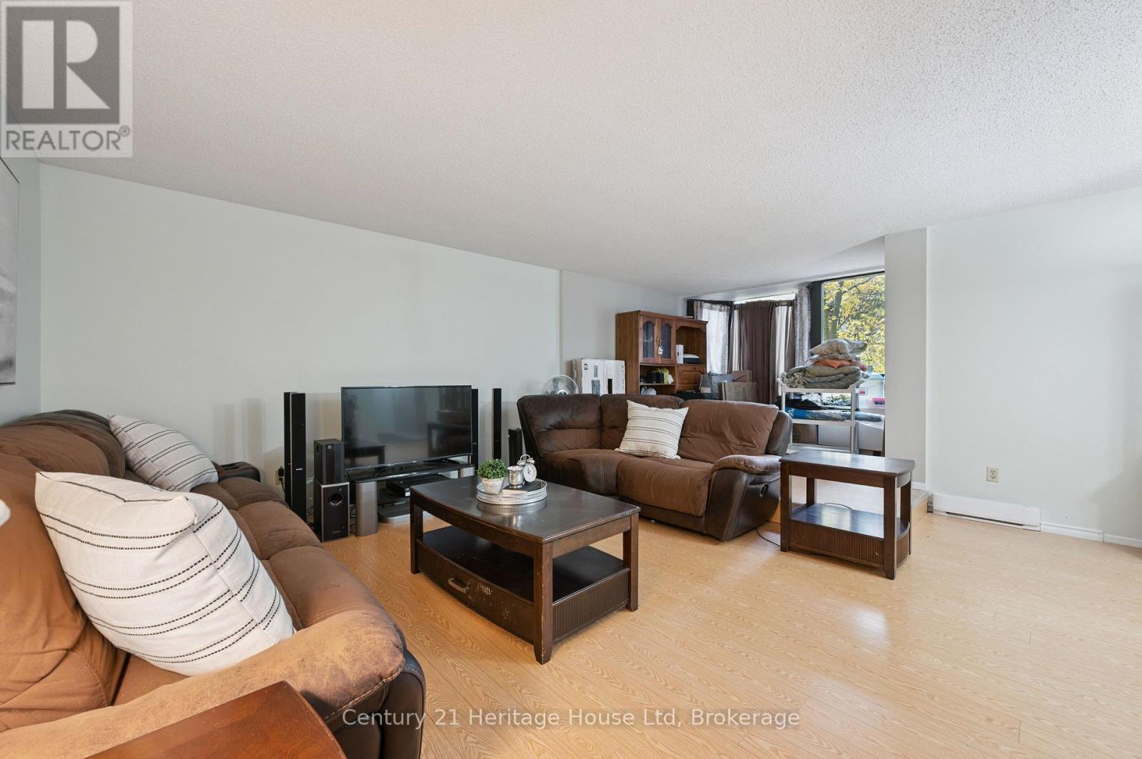 203 - 10 Ajax Street, Guelph, Ontario N1H 7N6 - Photo 1 - X12525804