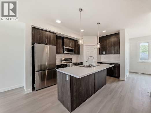 1921 Mccaskill Drive, Crossfield, Alberta  T0M 0S0 - Photo 9 - A2258179