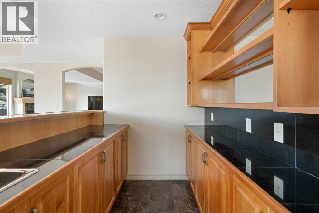 104 Grizzly Rise, Rural Rocky View County, Alberta  T4C 0B5 - Photo 28 - A2254075